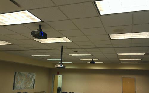 New far-throw projectors installed with wiring run through mounting pole for neatness.