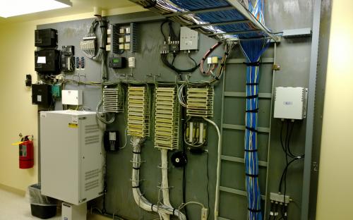 Communications wall after cleanup and equipment relocation.