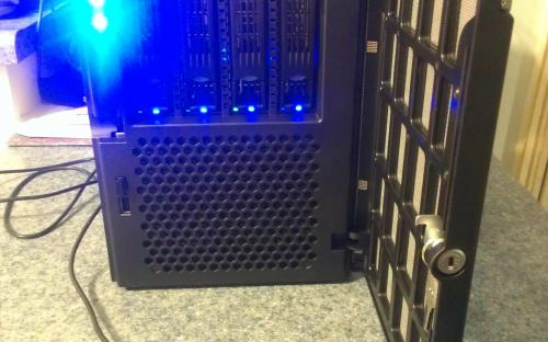 8TB RAID 5 disk array visible. Serves client backup, network storage, and web services backup.